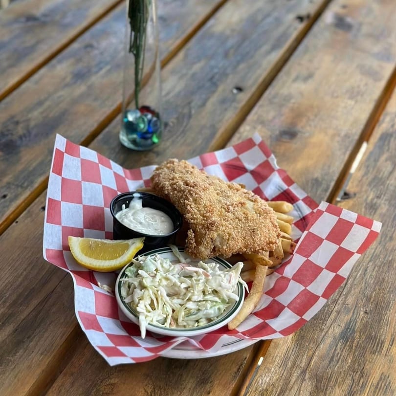 Chef Darrell’s Mountain Diner fish and chips with coleslaw, tartar sauce, and a lemon wedge.